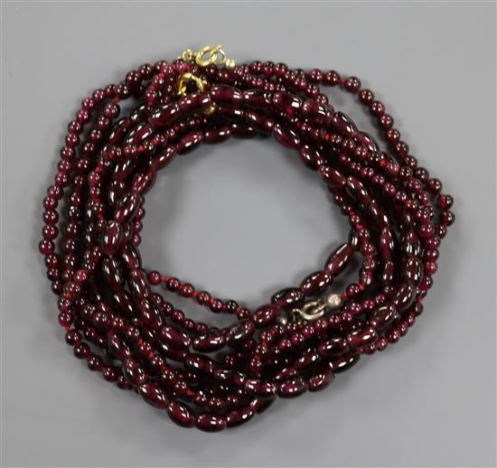 Three assorted garnet bead necklaces.